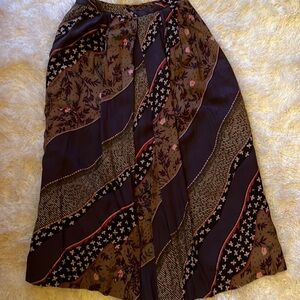 Tica purple and beige print lined rayon skirt. Dry clean only. Front pleat sz6
